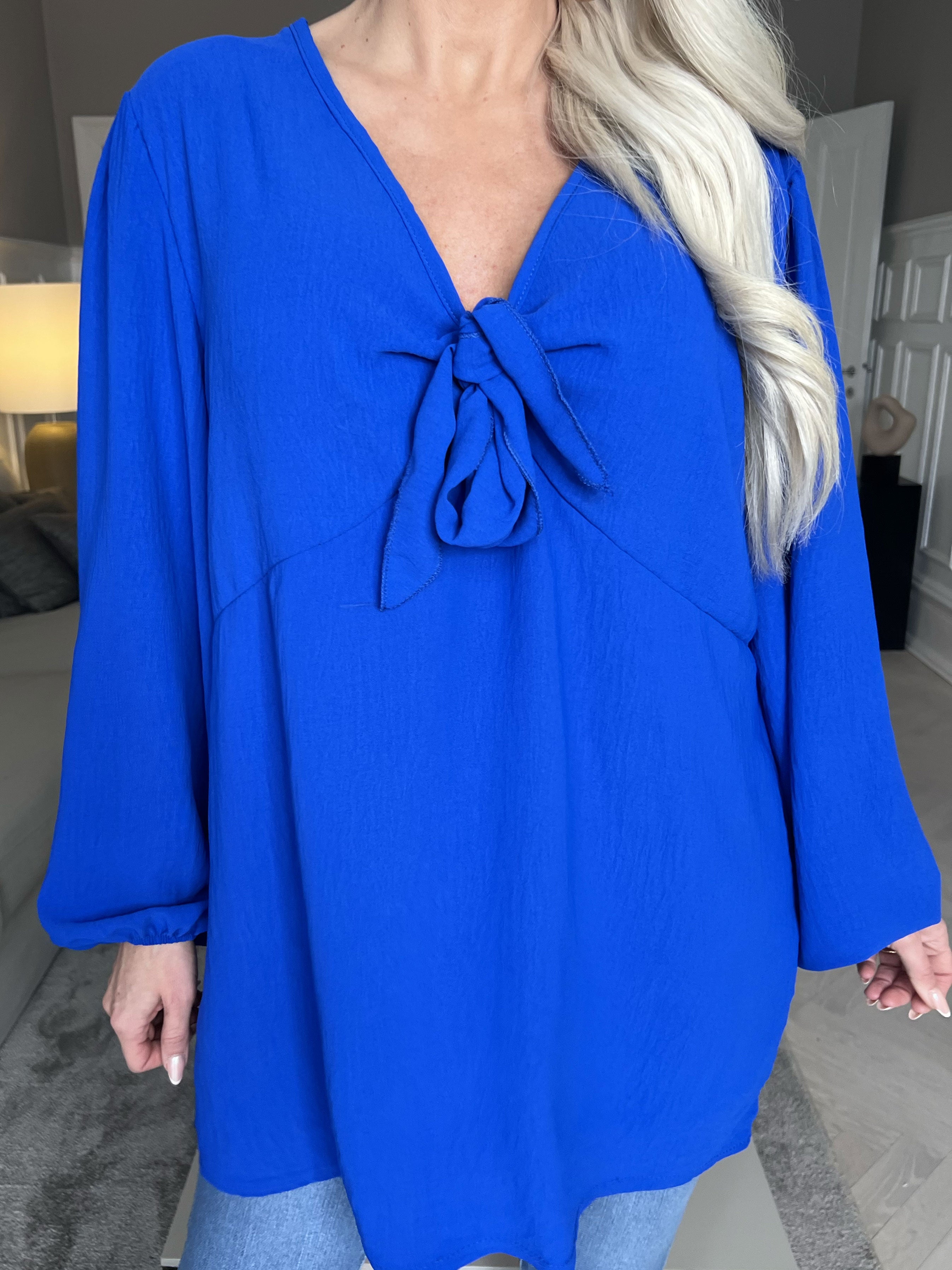 Cassandra - Söt tunika med rosett på bröstet